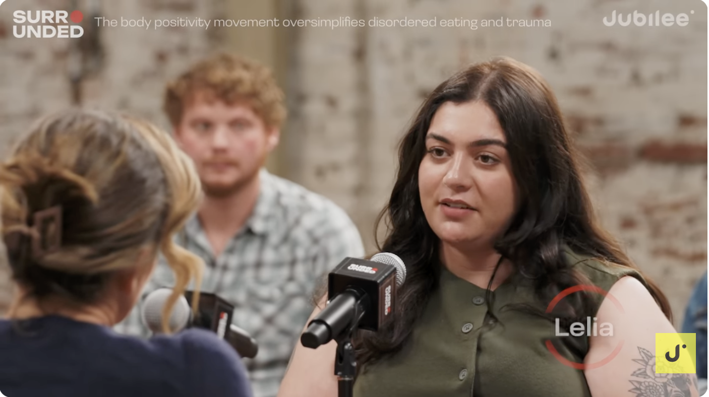 Participant named Lelia speaking, with caption that body positivity oversimplifies disordered eating and trauma